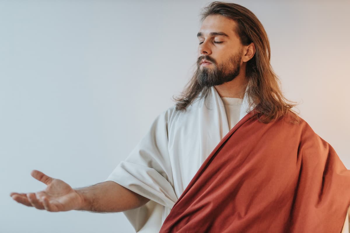 Jesus holding out his hand.